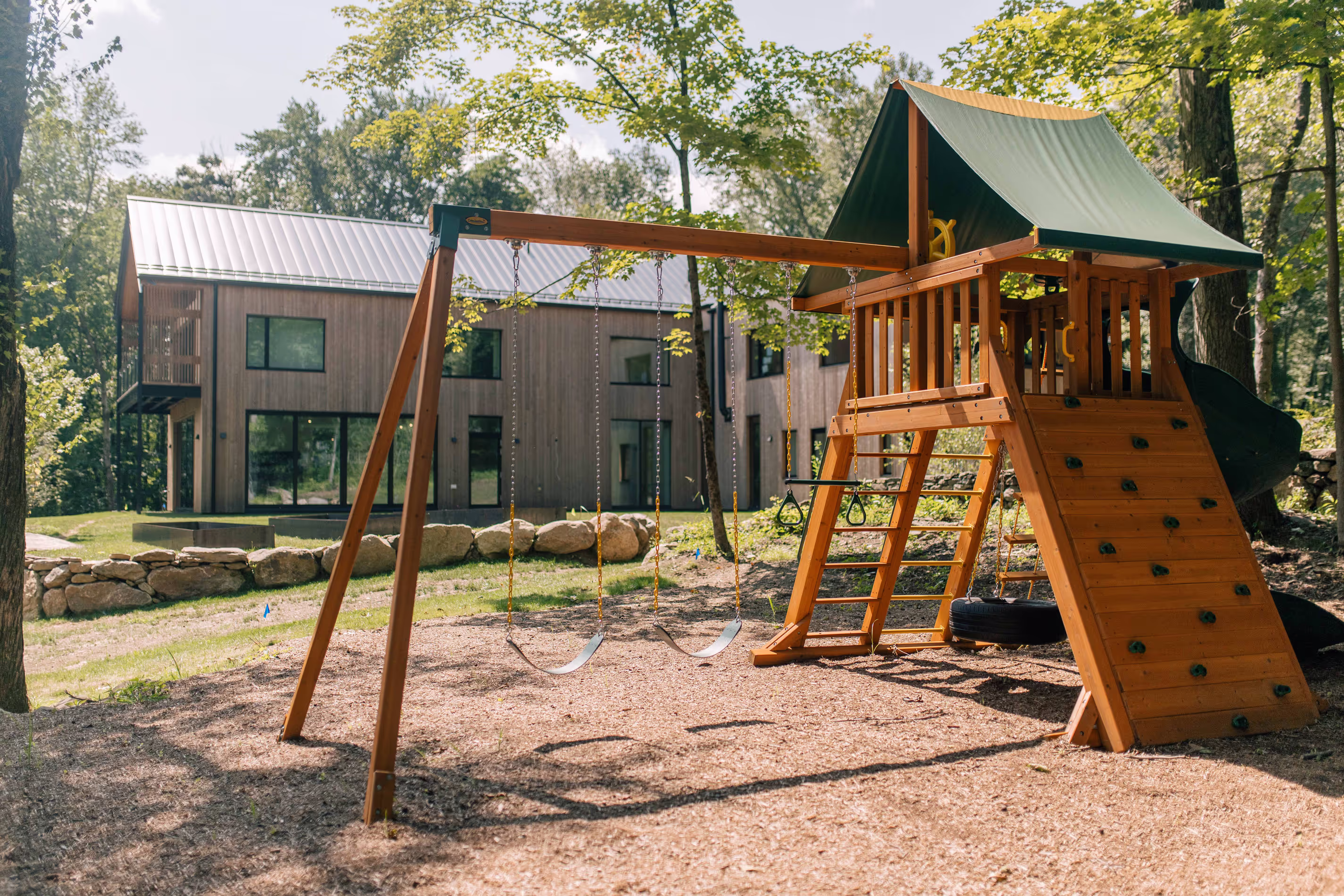 A wooden swing set in a garden