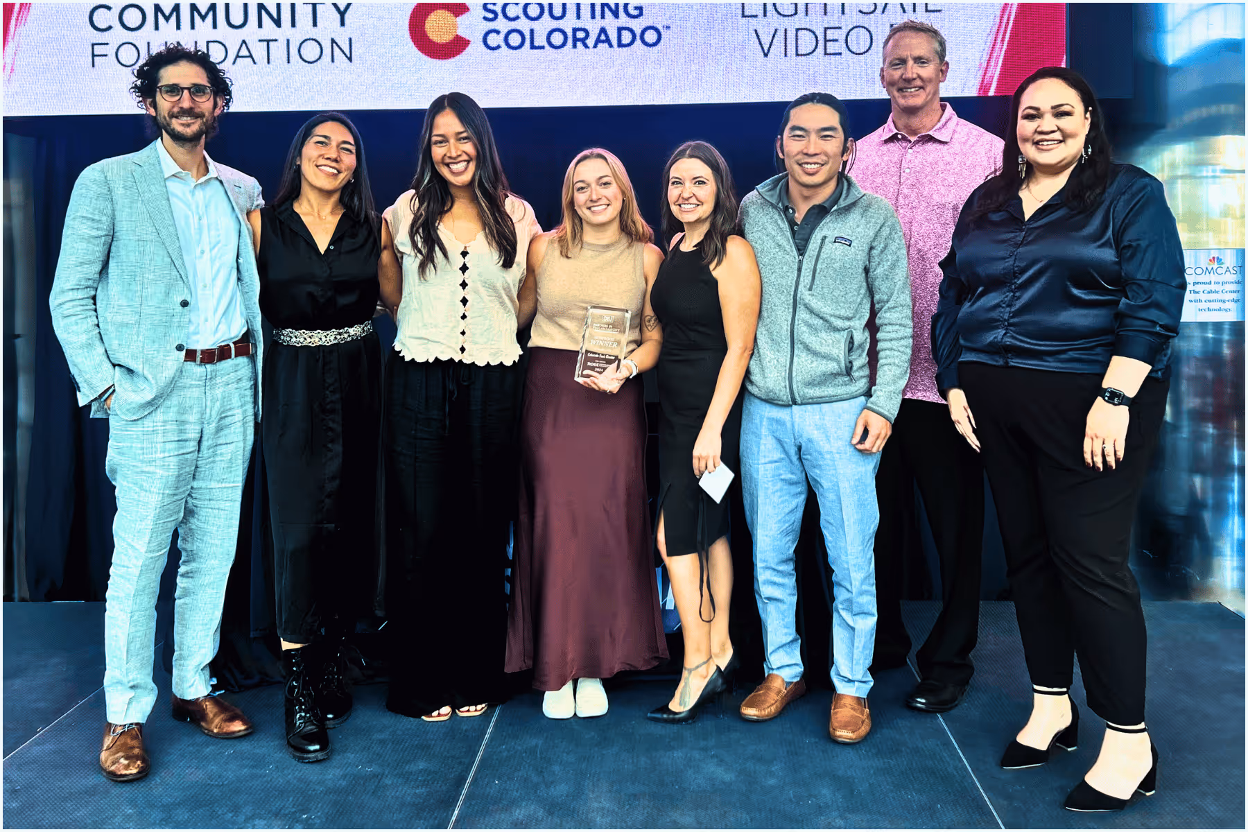 Group receiving award at Colorado community event.
