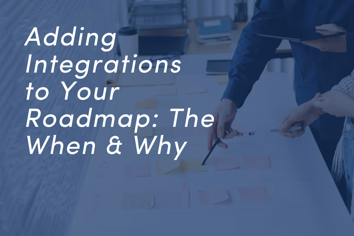 Business professionals reviewing documents and diagrams on a table during planning session.