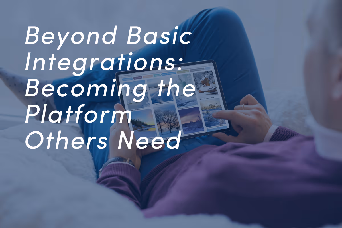 Person holding tablet showing multimedia content grid with colorful thumbnails.