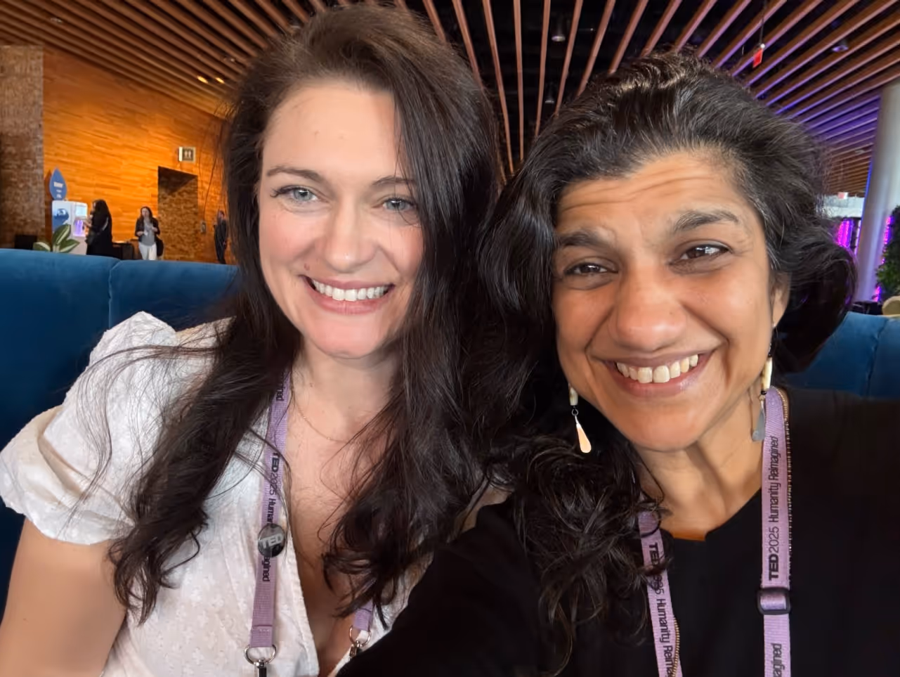 Natalie Bragg taking a selfie with another attendee during the TED conference.