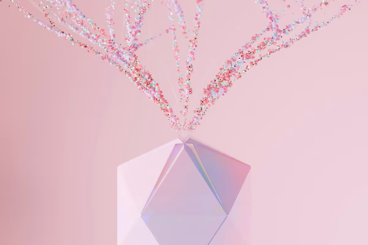Abstract 3D crystal form with colorful particle streams radiating outward on pink background, representing AI processing and data flow