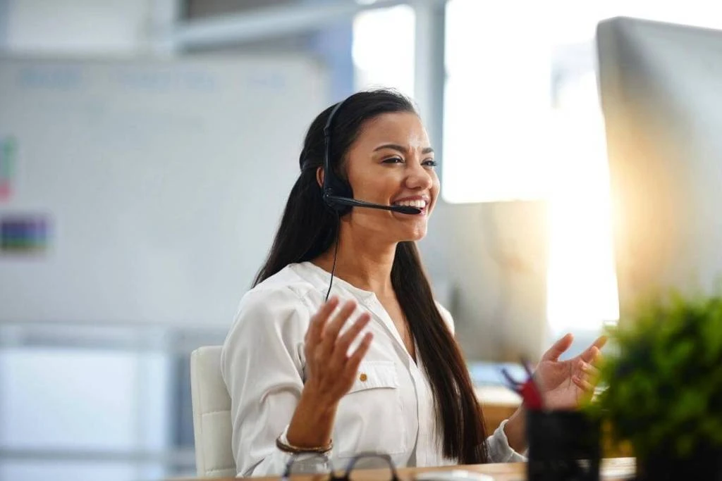 customer support agent smiling - What Is Customer Support