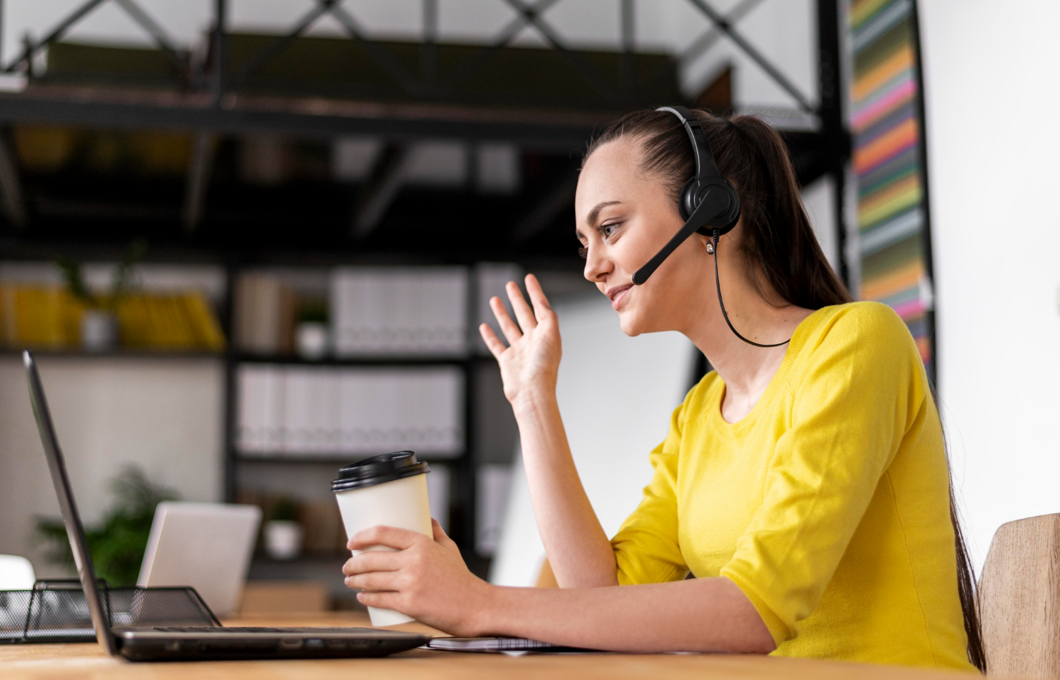 customer support agent working in an office - Help Desk Best Practices