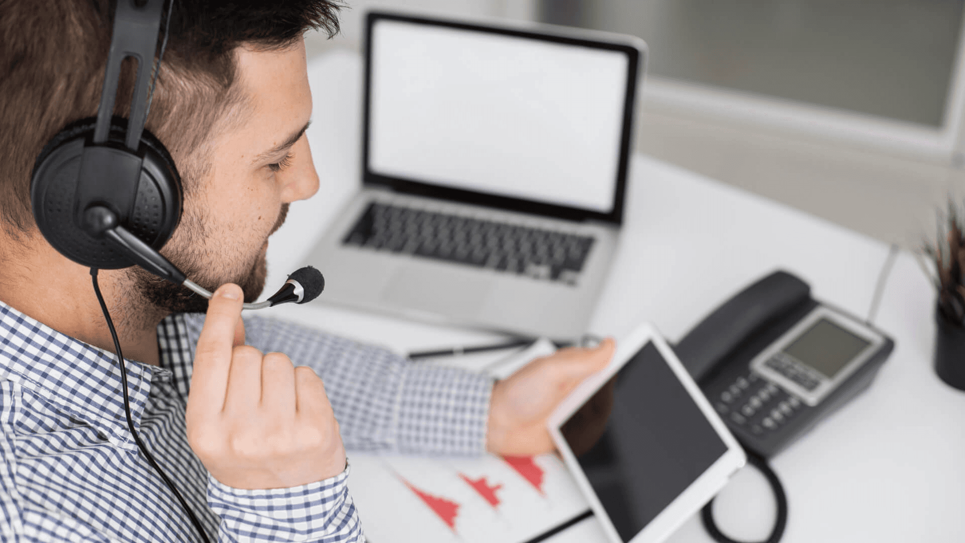  Man with headset using tablet - Best IVR System