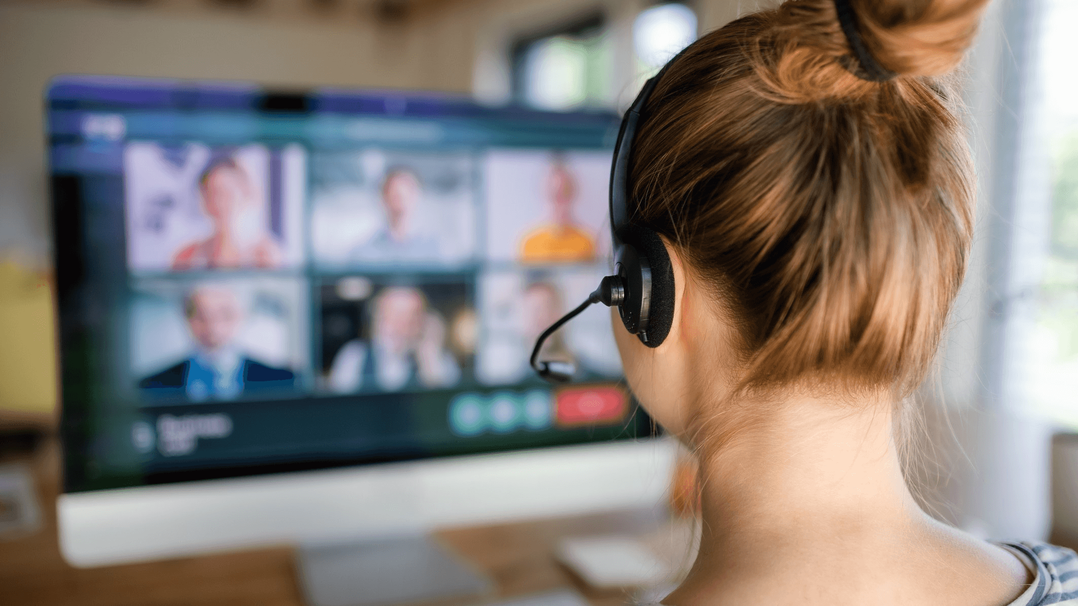 Woman wearing headset during video call - Best IVR System
