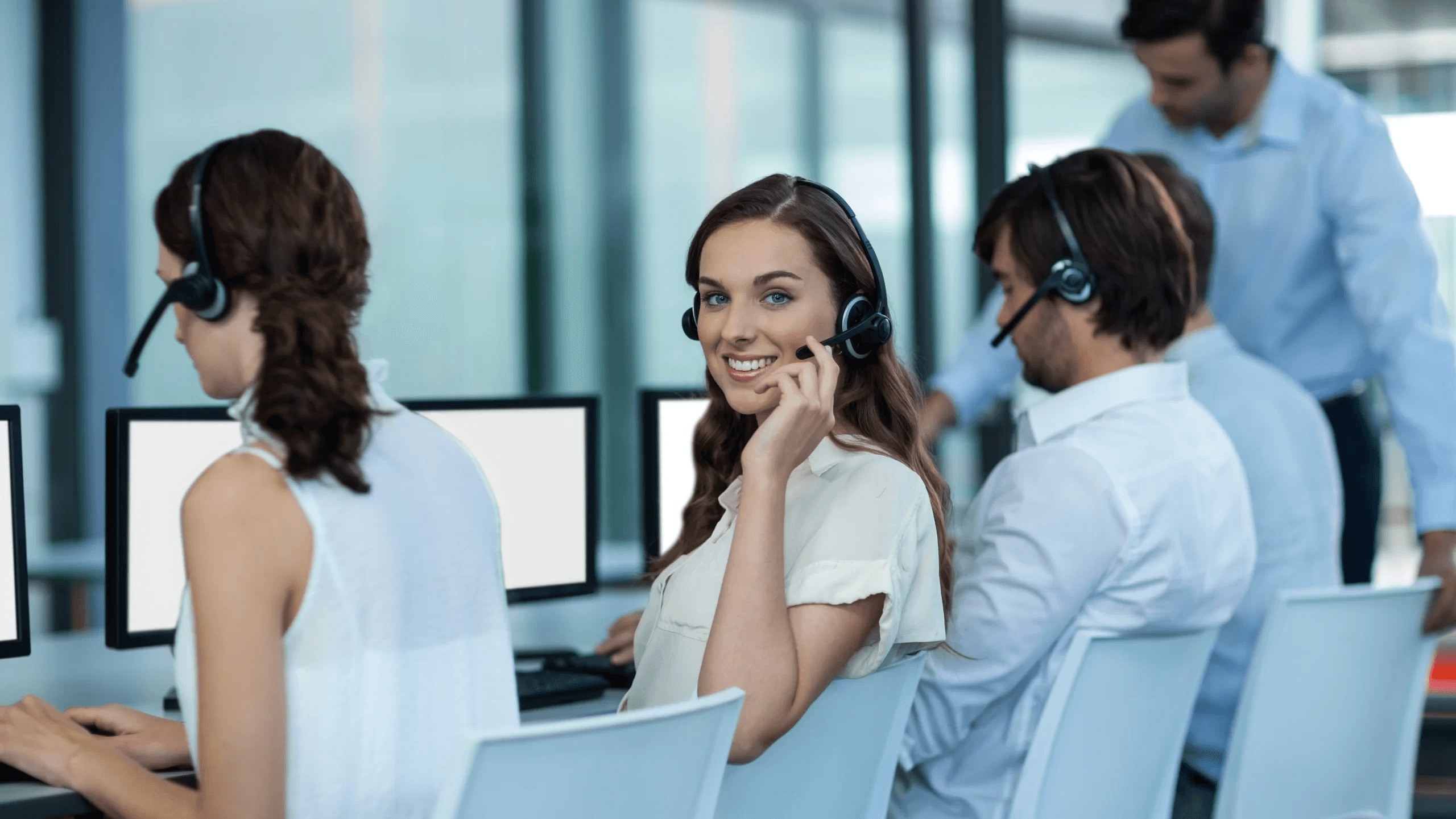Call center staff working on computers - Best IVR System for Small Business