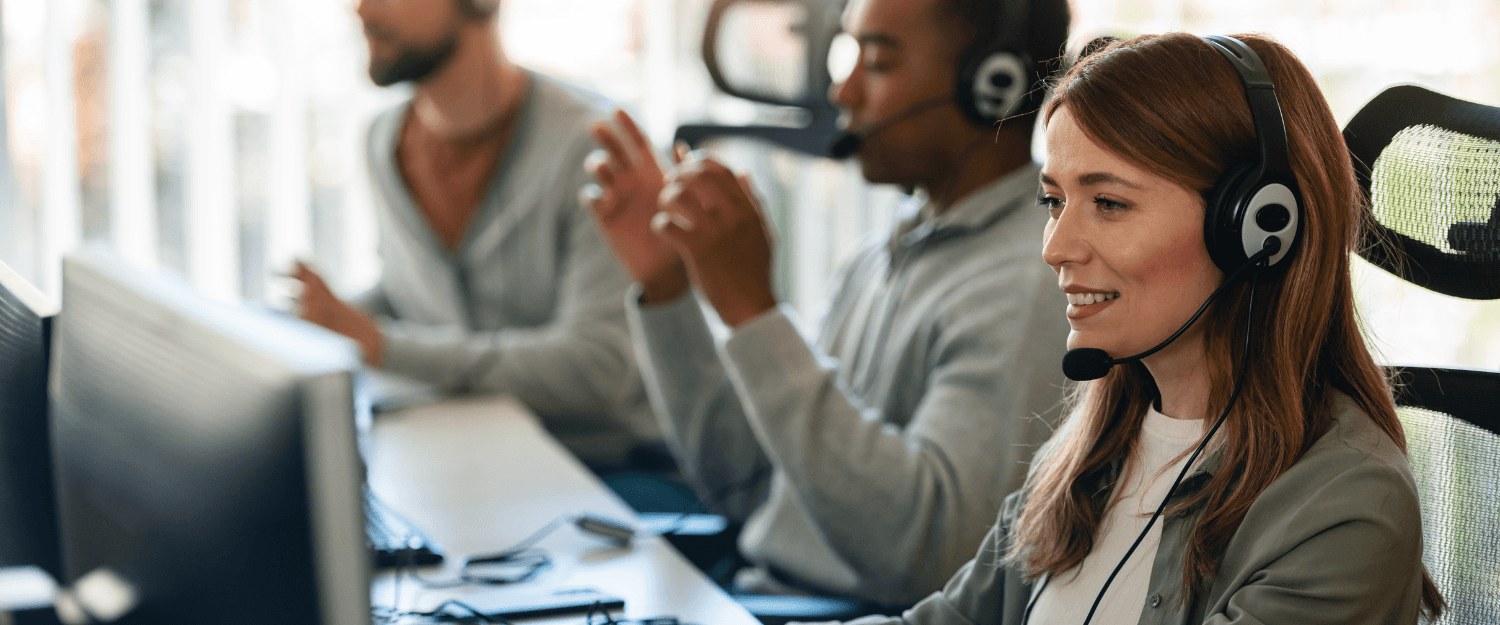 Customer support team wearing headsets - How to Improve CSAT Scores in a Call Center