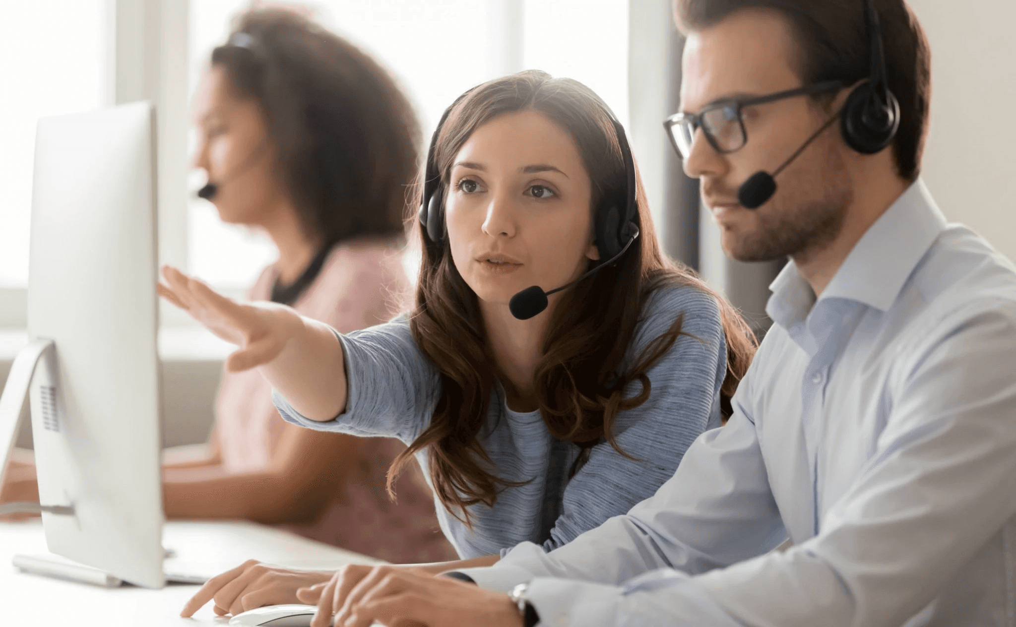  Colleagues working together in a call center - Call Center Monitoring Best Practices