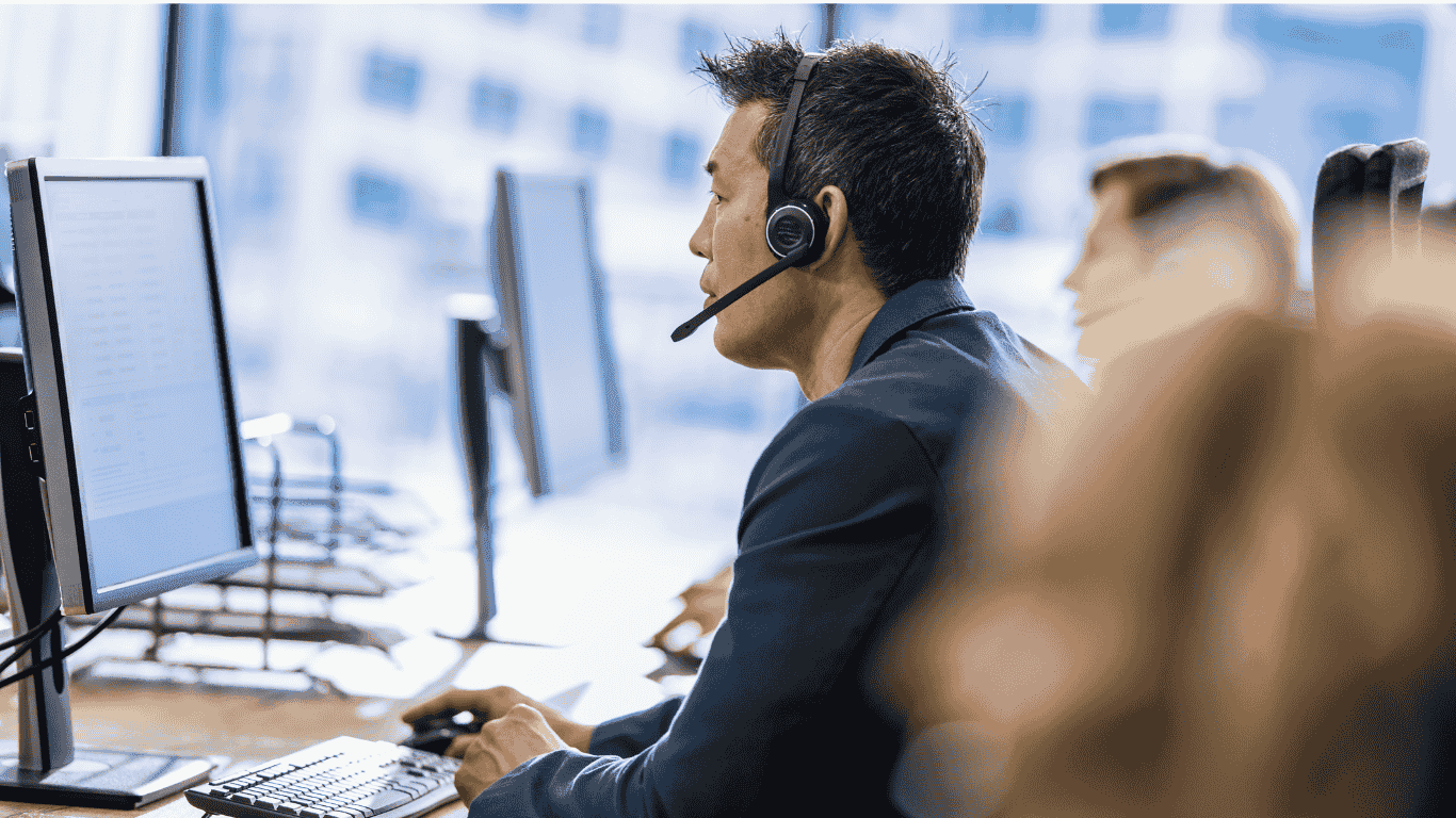 Call center employees assisting customers - How to De-Escalate a Customer Service Call