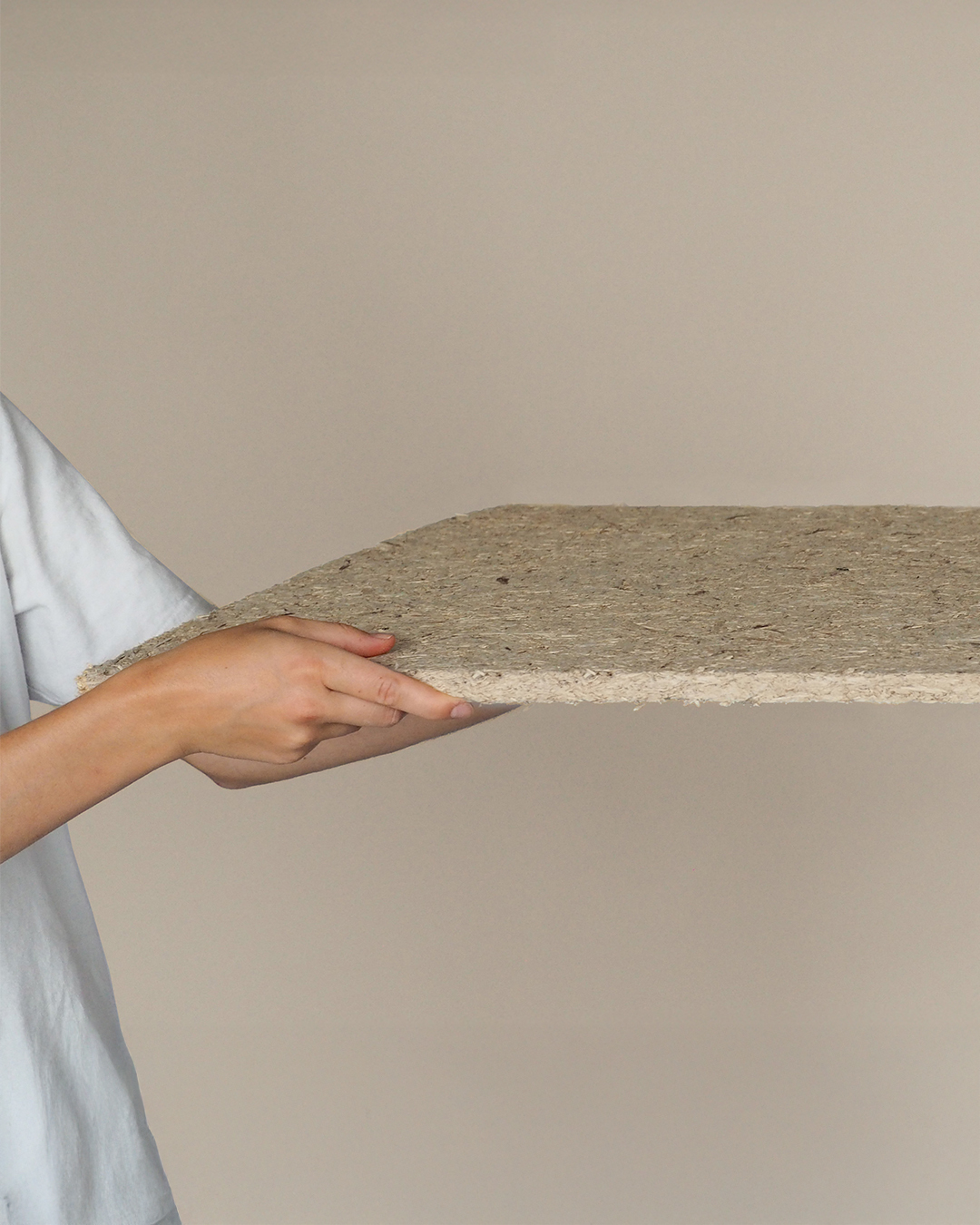 A variety of sustainable building materials made from natural fibers, showcasing different textures and compositions for eco-conscious construction.
