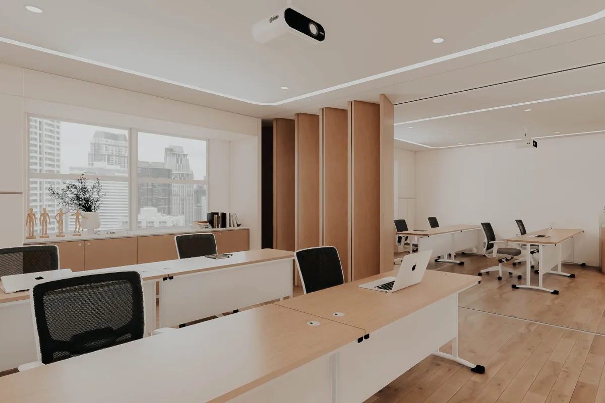 Inclusive office design with specialized wellness rooms and open collaboration areas