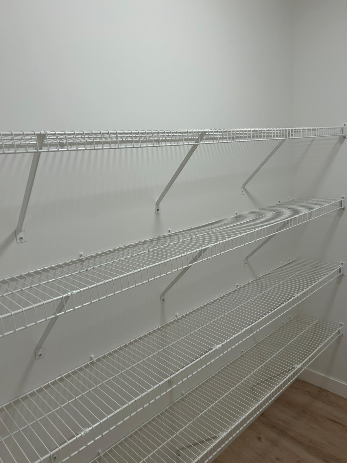 Walk-in closet storage shelving installed by local Edmonton contractors