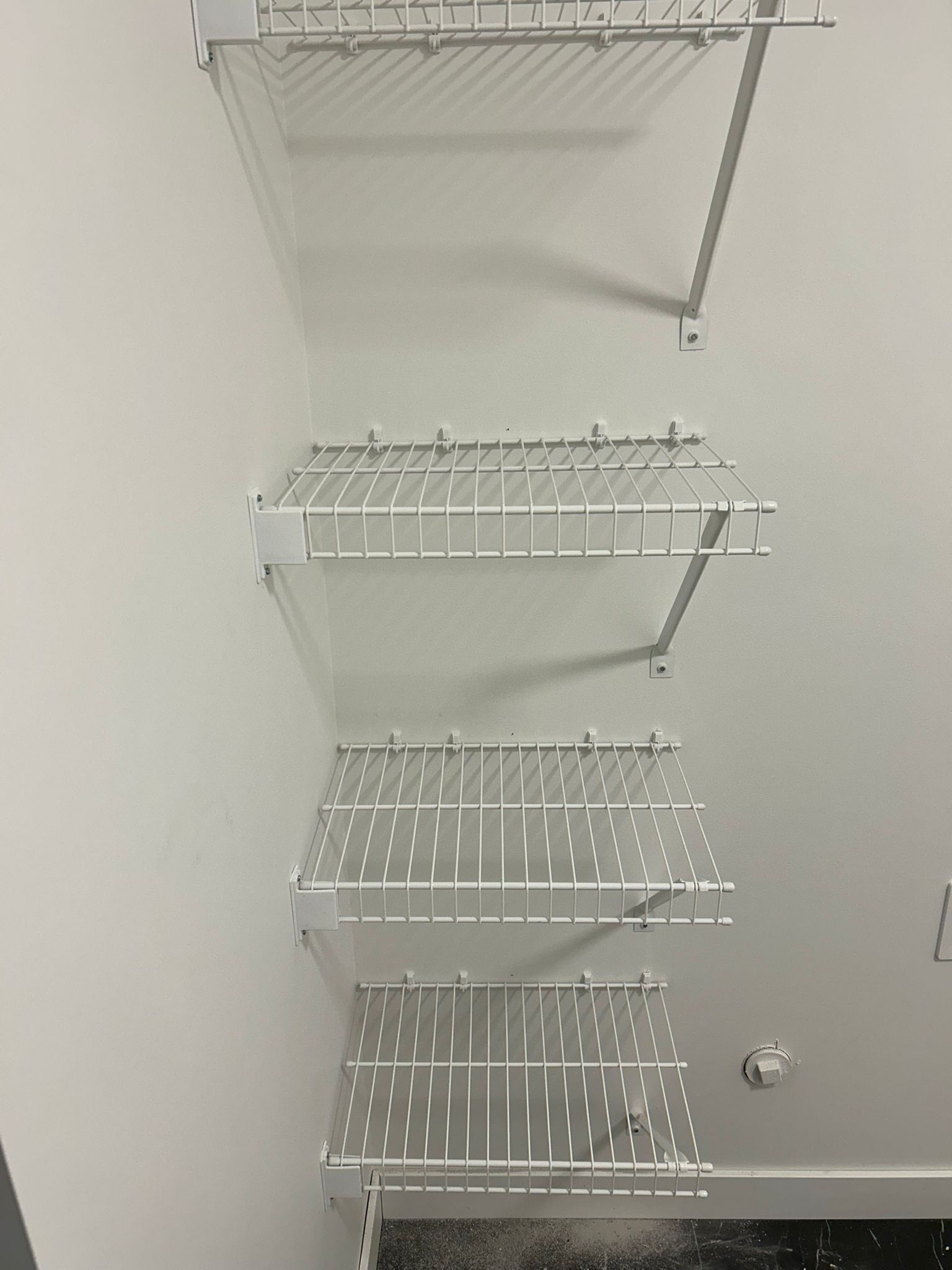 Durable white wire shelving system for residential storage in Leduc