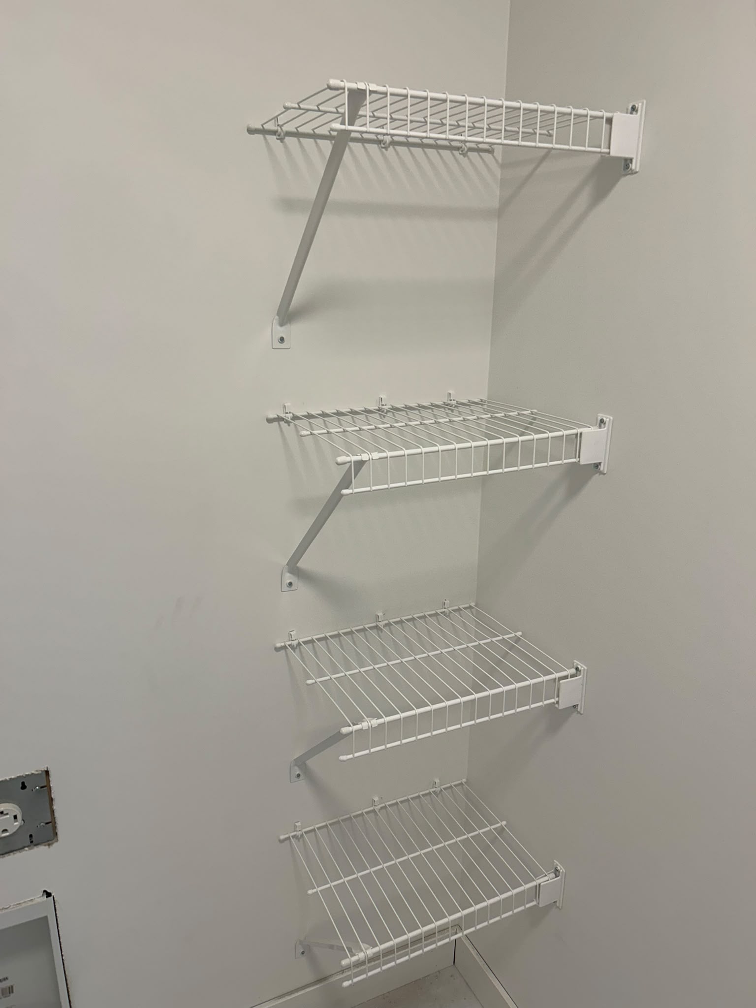 Functional wire closet shelving installation for builders and homeowners in Alberta