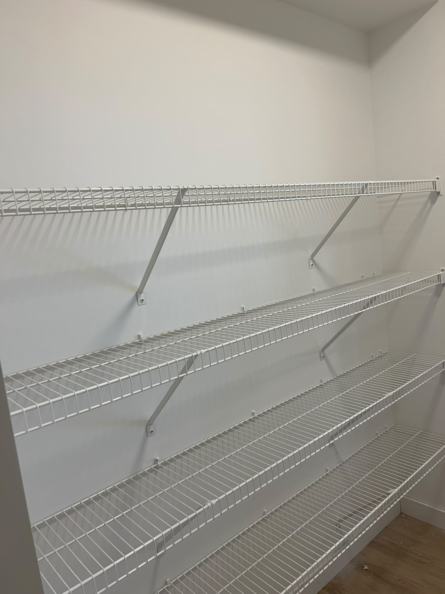     Multi-level wire shelving organizer for compact closet spaces in Spruce Grove