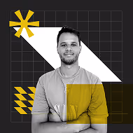 A young man smiling with arms crossed, standing against a geometric background featuring yellow and white shapes on a dark grid. The overall design has a modern, graphic aesthetic.