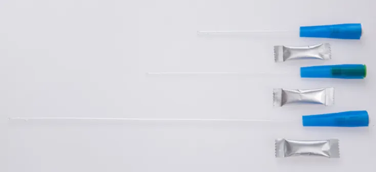 Urinary catheter bag with lubricant