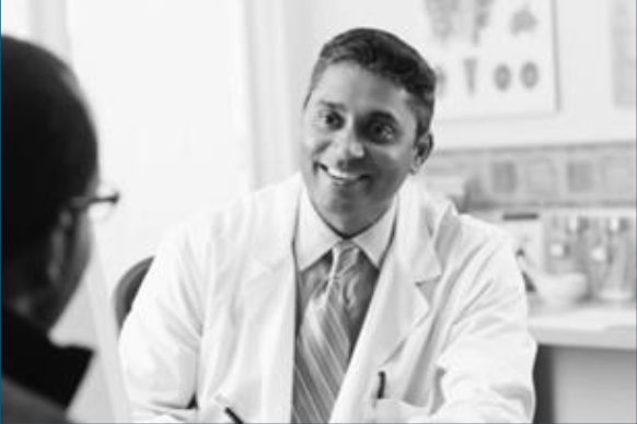 Happy physician speaking with a person