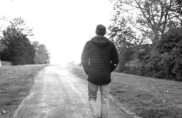 Person walking in a serene park