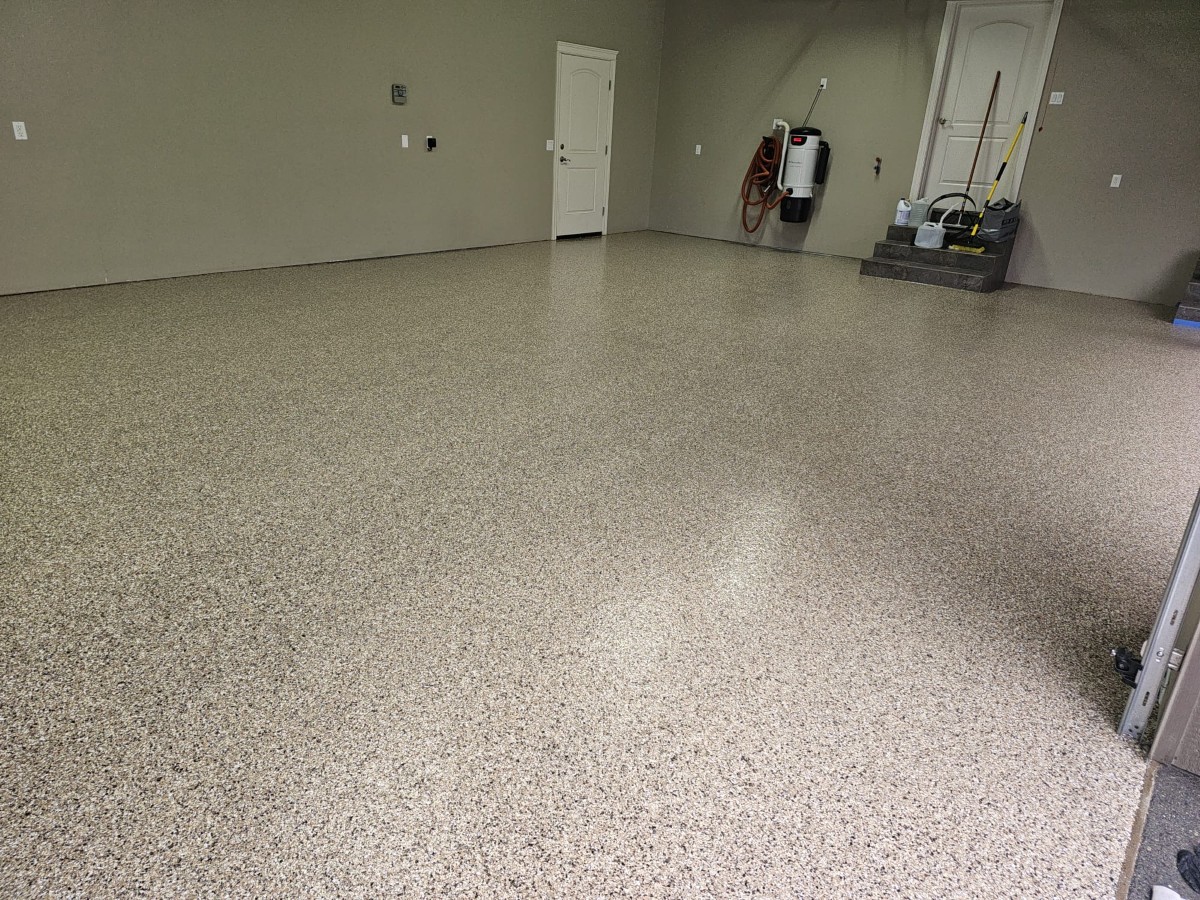 Beige flake epoxy floor in a residential garage