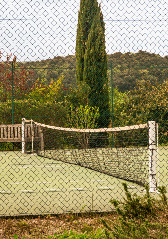 Open-air tennis court on a Provencal estate, perfect for a match with friends or family