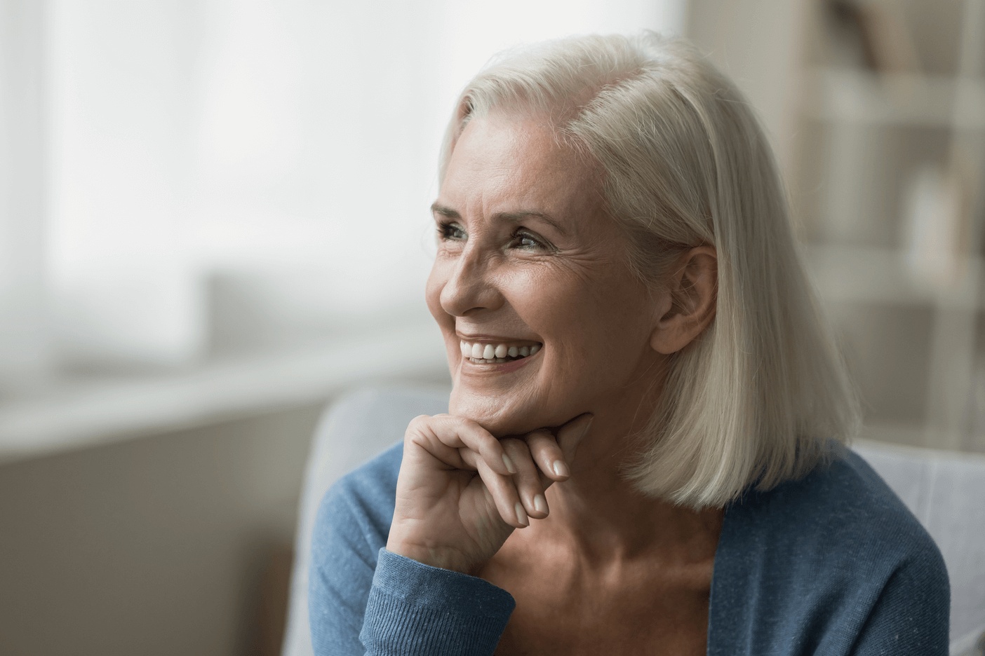Smiling older woman showing natural-looking teeth after treatment with the best same-day crowns in Mountain View, CA.