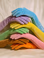 Stack of hands wearing colorful gloves in blue, purple, green, yellow, and orange.