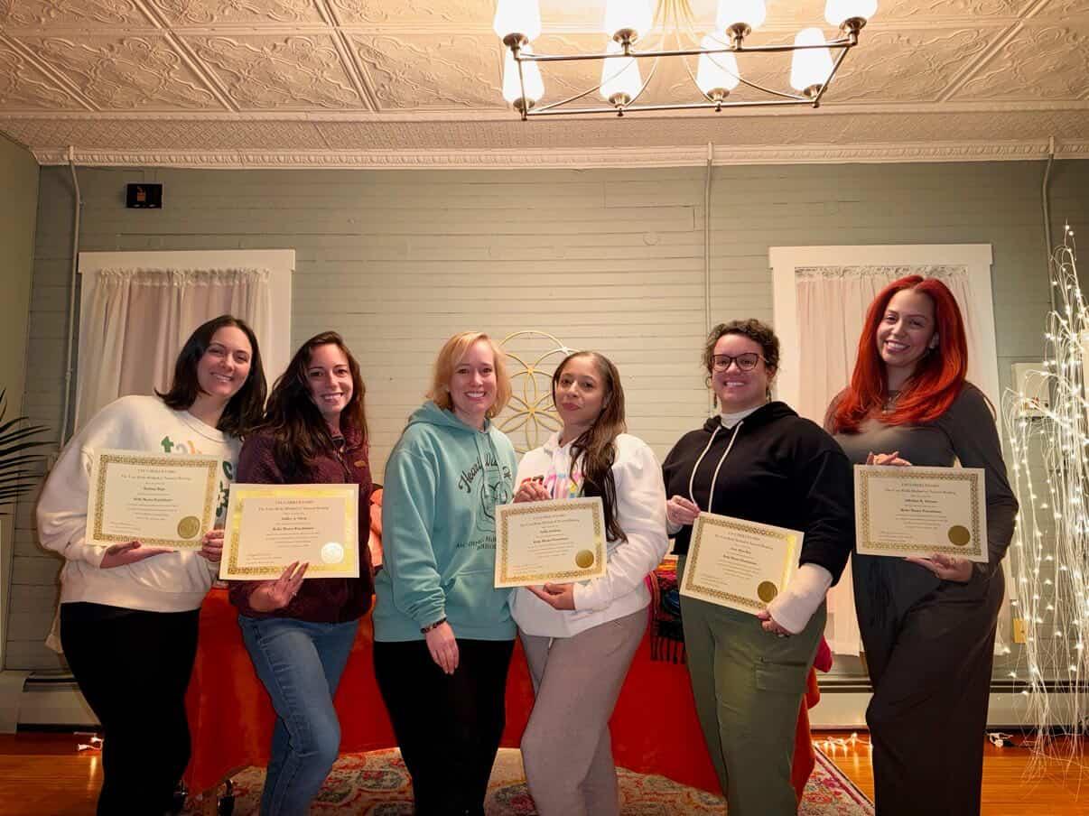 Amy giving a participant reiki during an event