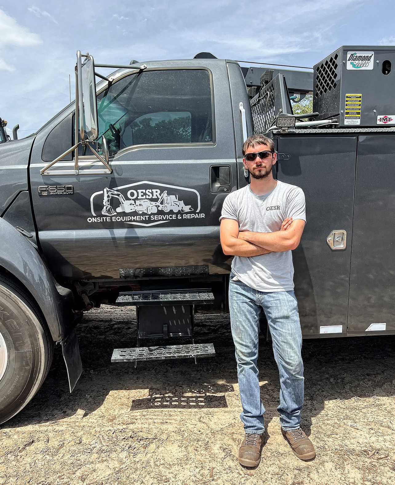 An independent Heave technician in front of his fully-equipped mobile service truck