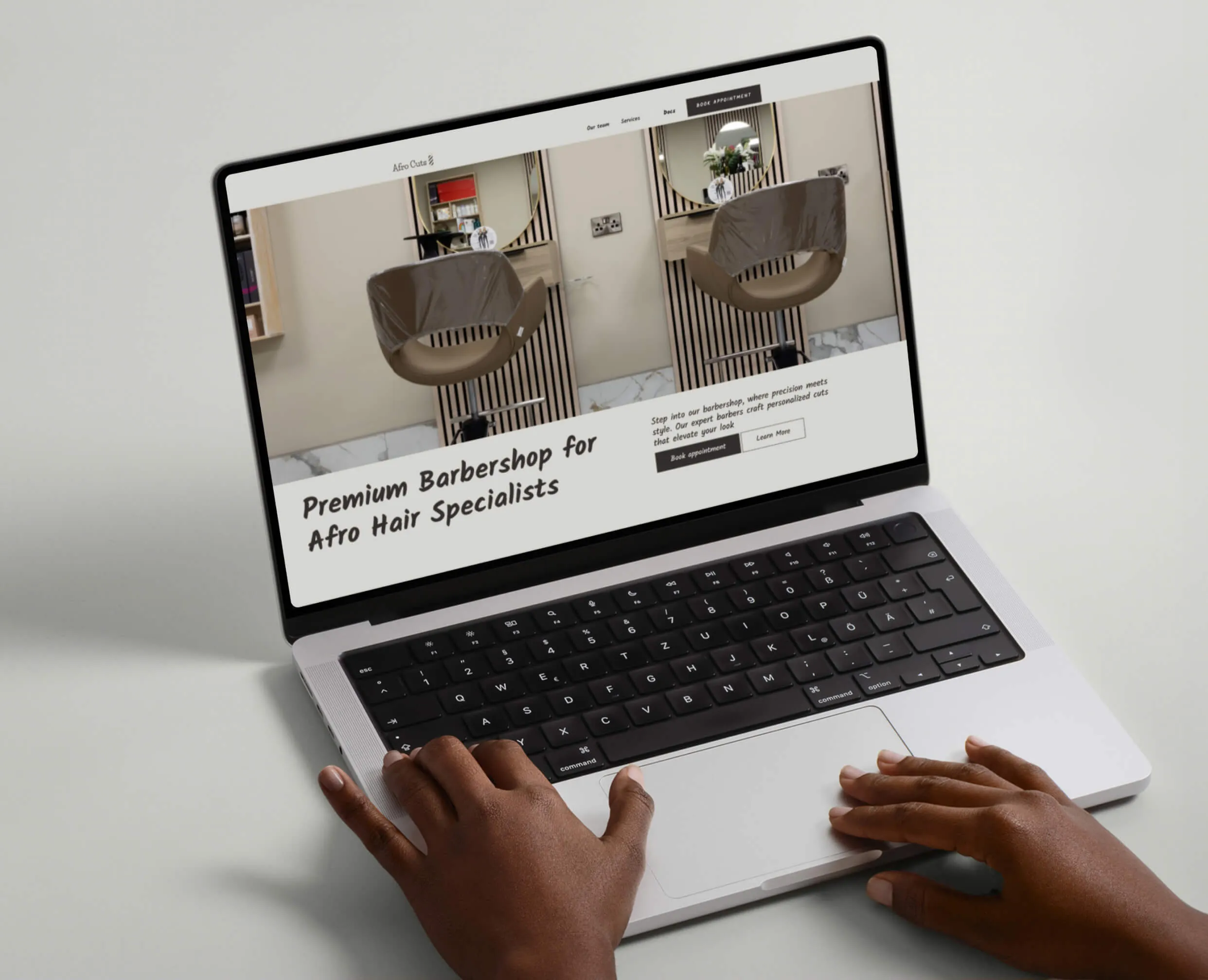 Mobile view of the barbershop website's home section with a bold headline, logo, and a background image of the barbershop interior, highlighting the inviting atmosphere.