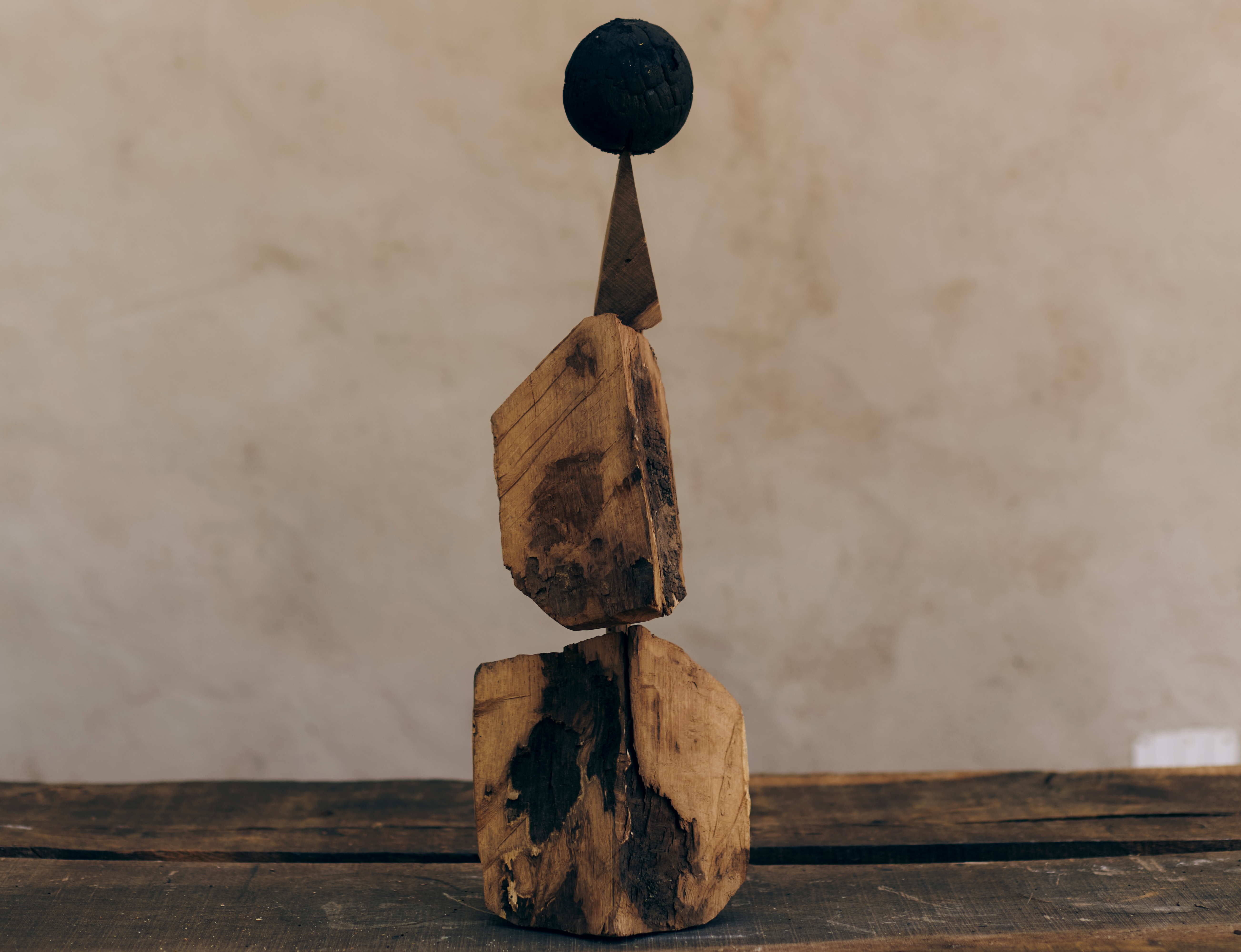 "Conjuring” found wood and burnt wooden sphere