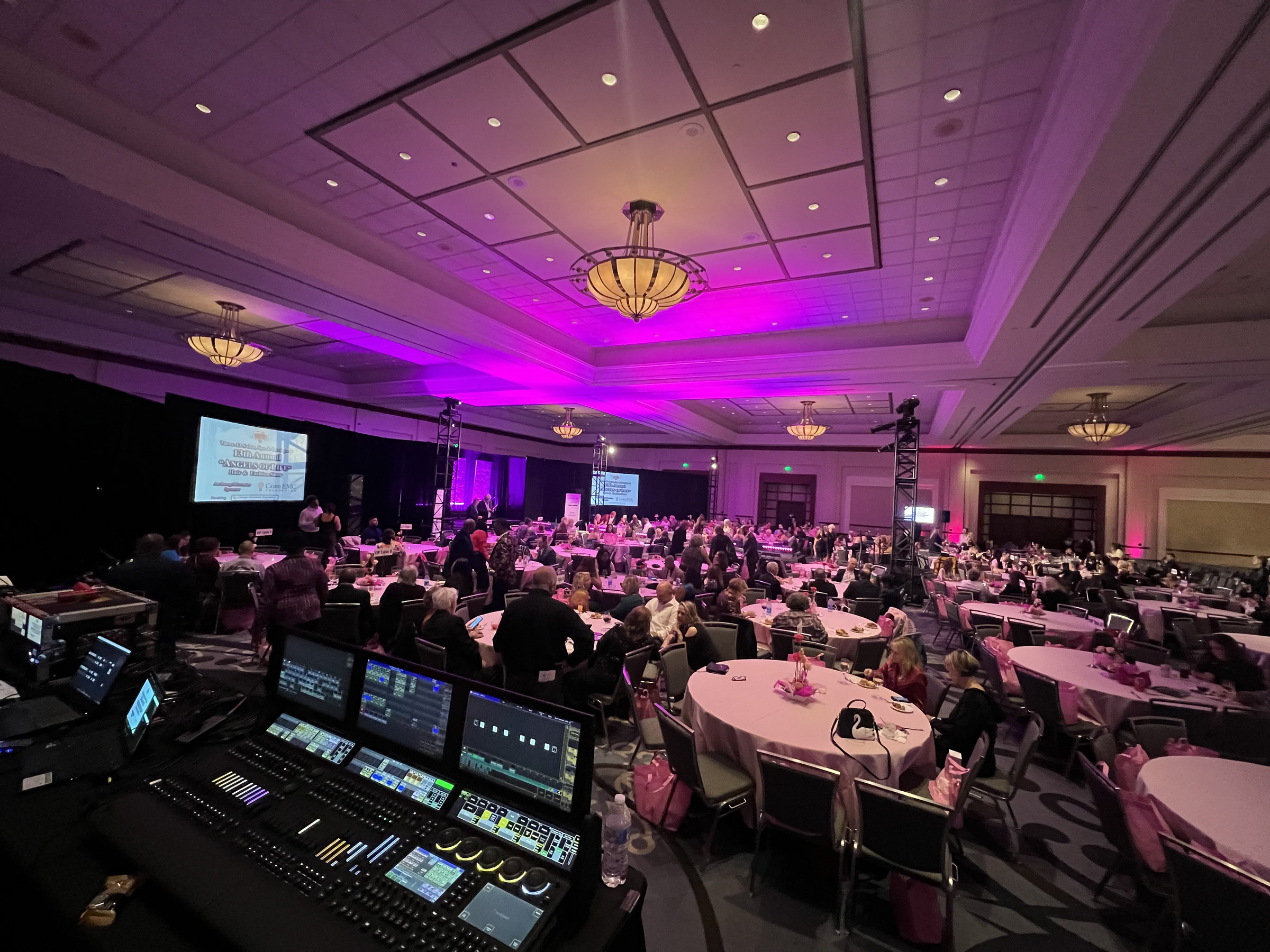 Corporate general session stage with LED video wall backdrop built by True Productions in an Atlanta ballroom