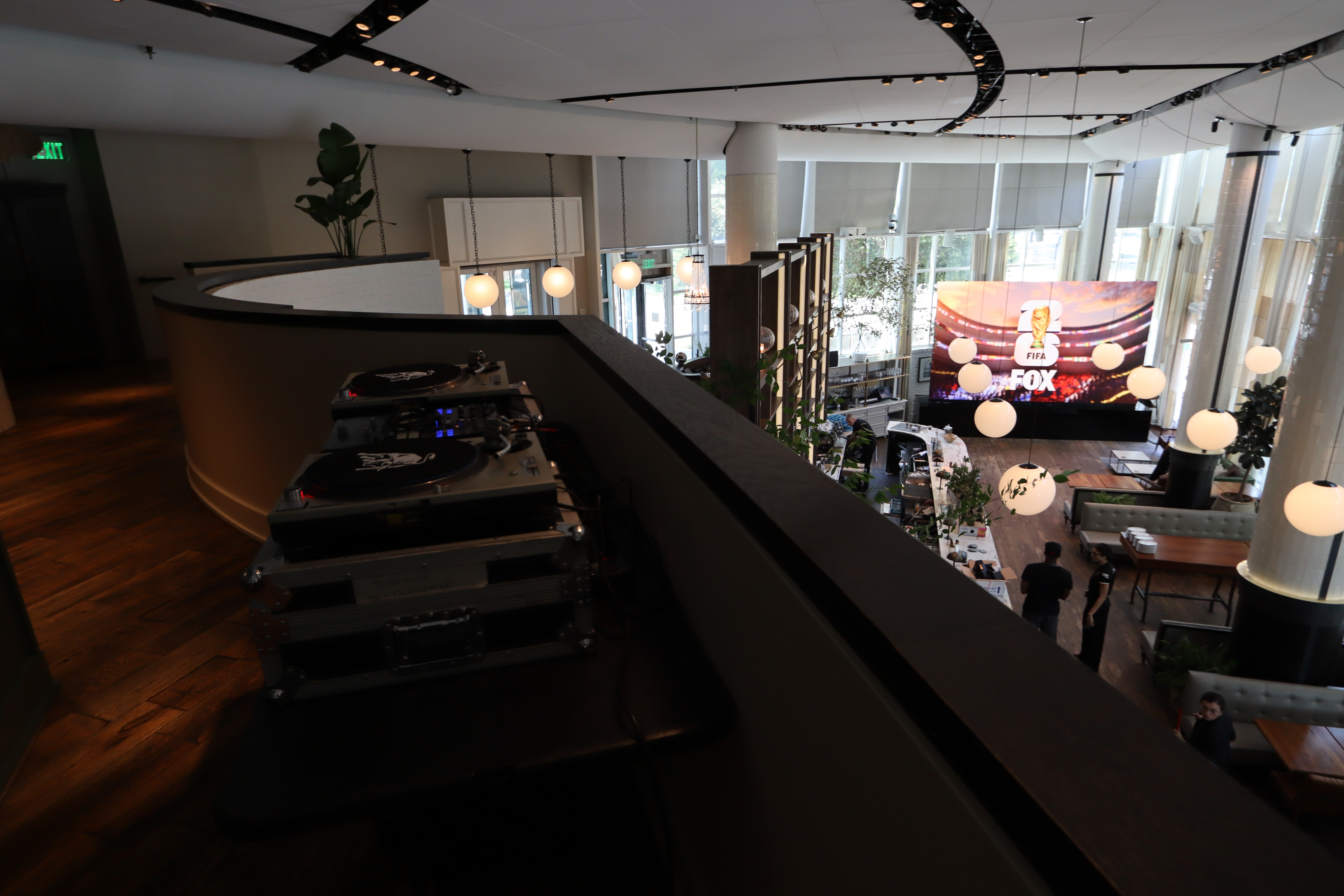 Road cases staged on a mezzanine walkway during load in