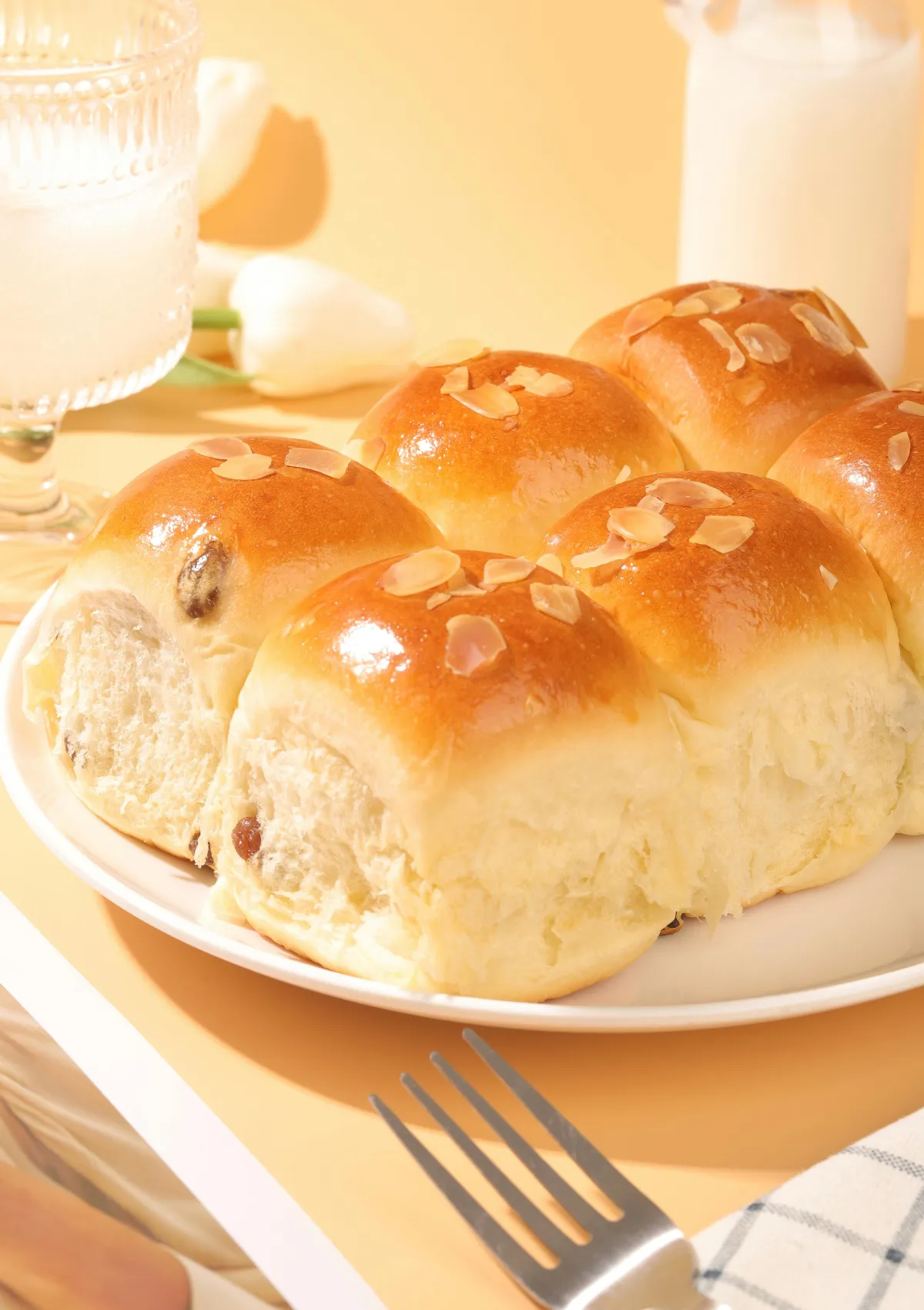 Golden milk buns topped with almond flakes
