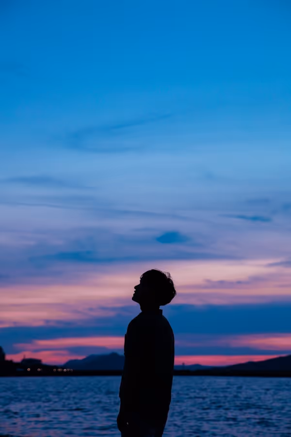 man standing near beach