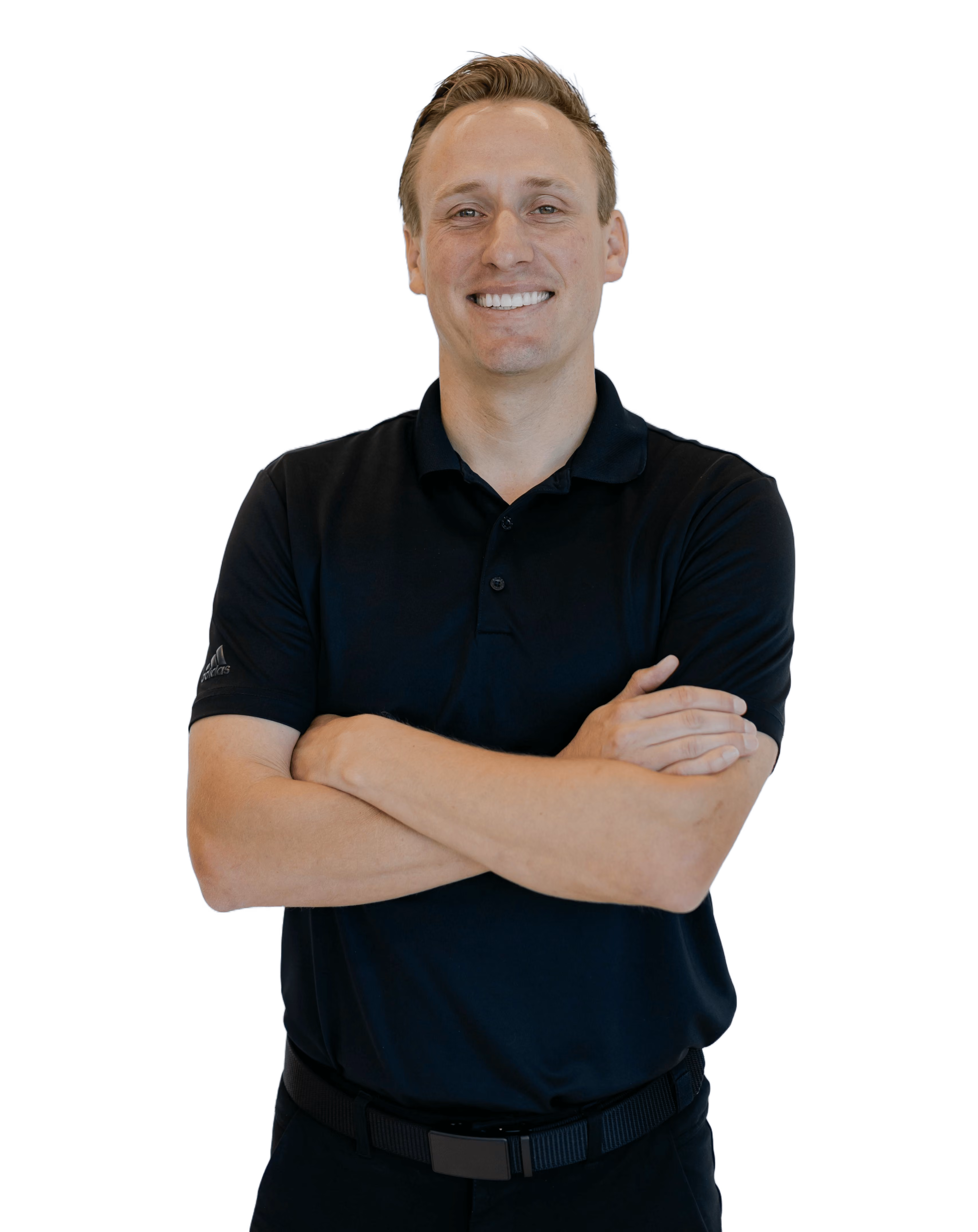 Dr Harris with short light brown hair wearing a black polo shirt, arms crossed.