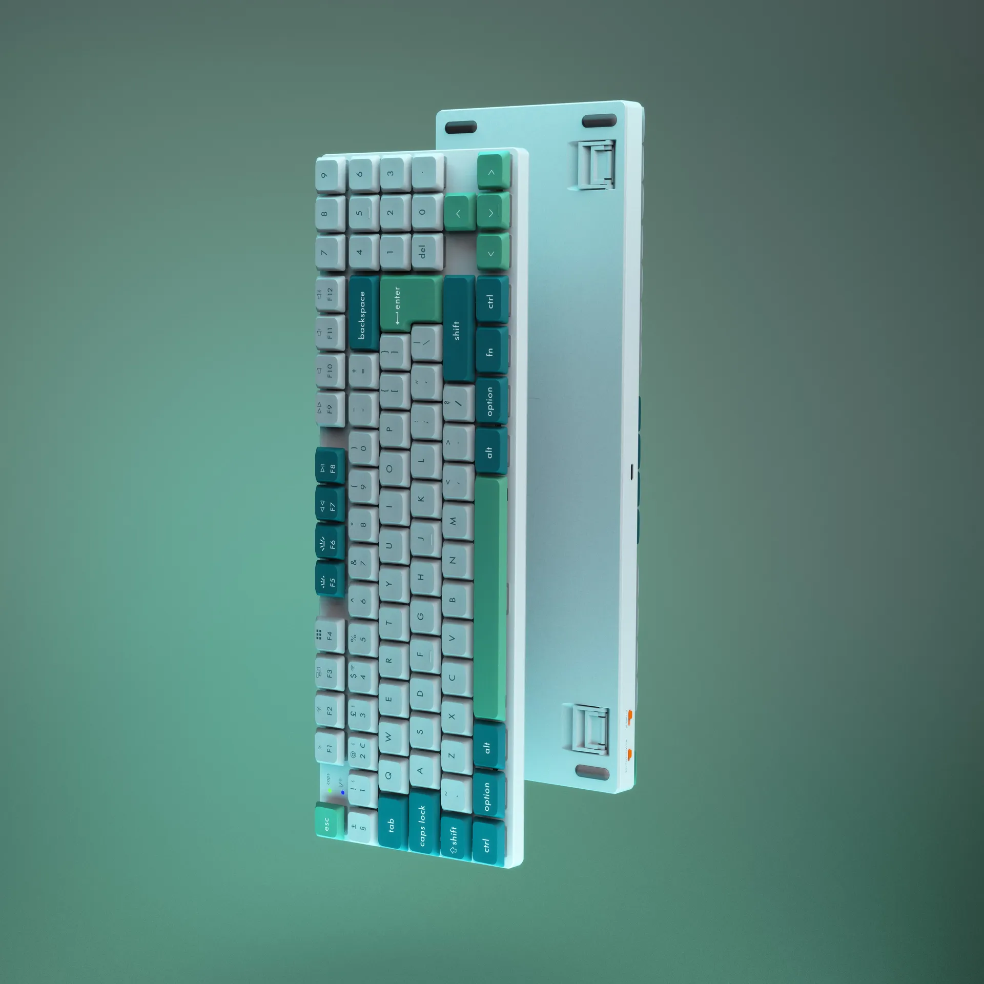 Two keyboards back to back on green gradient background