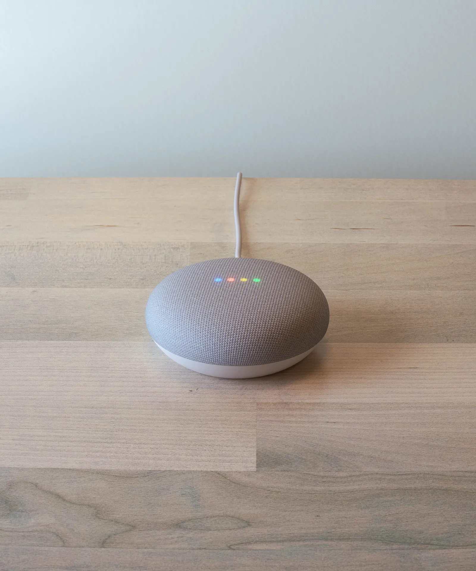 google home mini on a scandi-style side table
