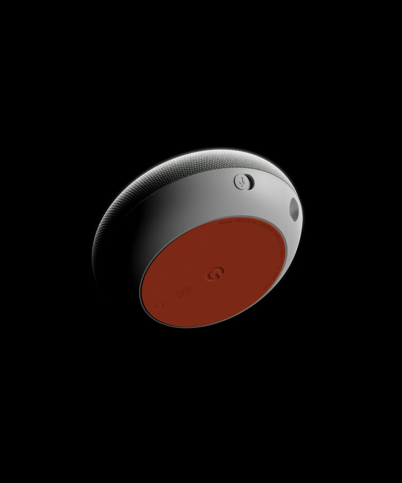 google home mini floating on black dramatic lighting