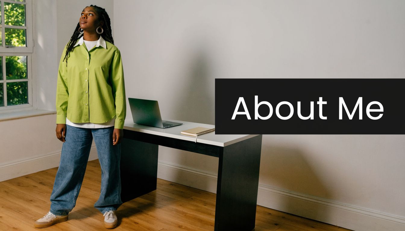 A young woman in a lime green shirt standing next to a desk with a laptop.