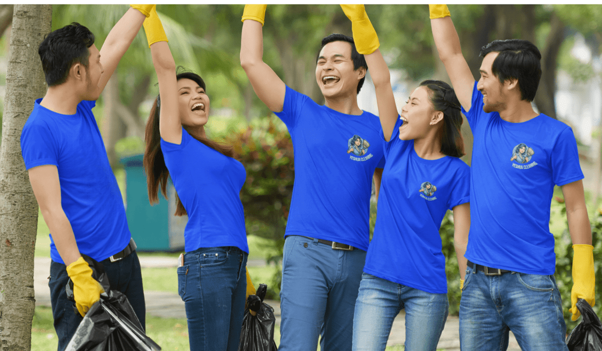 A team of five Yeshua Cleaning employees actively cleaning a large residential space in Miami. The team is coordinated and efficient, each member equipped with cleaning supplies and tools, working together to ensure every corner of the home is spotless. Their uniforms are neat, and they demonstrate teamwork and dedication to providing excellent service.