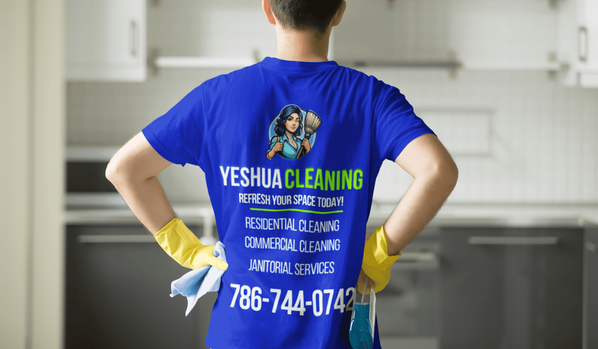 Yeshua Cleaning employee wearing a uniform, meticulously deep cleaning the interior of a bright and airy Miami Airbnb. The room features modern decor with large windows that let in plenty of natural light. The employee is focused on scrubbing the kitchen counter, with various cleaning supplies and equipment neatly arranged around them. The scene emphasizes a professional and thorough cleaning service.