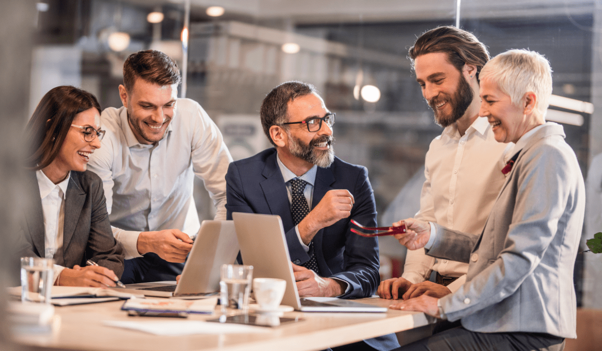 An office space cleaned by Yeshua Cleaning with employees looking happy and productive. The environment is bright and immaculate, enhancing the mood and productivity of everyone in the room. The clean setting reflects Yeshua Cleaning’s commitment to providing a healthy workplace.