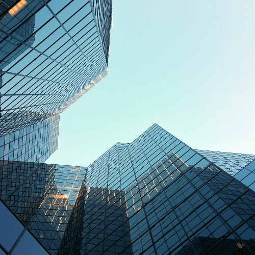 A row of modern commercial financial institution buildings with pristine exteriors in Miami, representing the high-quality cleaning services offered by Yeshua Cleaning.