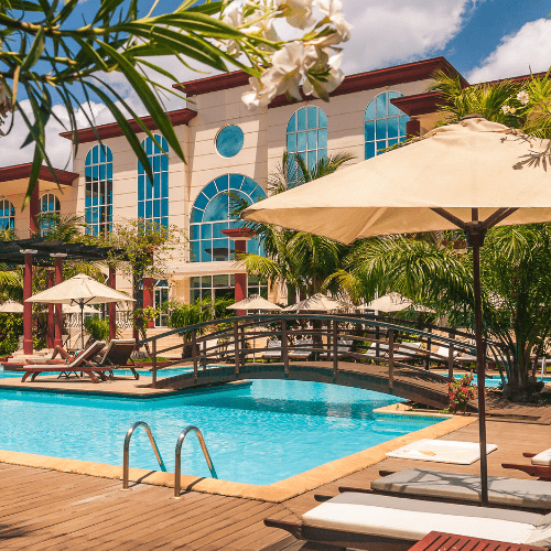 A resort exterior in Miami being pressure cleaned, with clean walkways and bright, refreshed surfaces, demonstrating Yeshua Cleaning's effective pressure washing services.