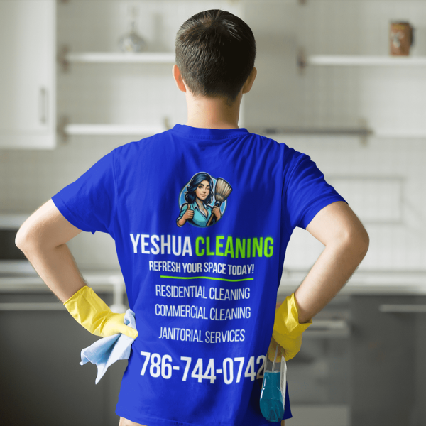 A Yeshua Cleaning employee spraying and wiping down a restaurant table in a Miami eatery, using FDA-approved disinfectants to ensure a hygienic and safe dining area.