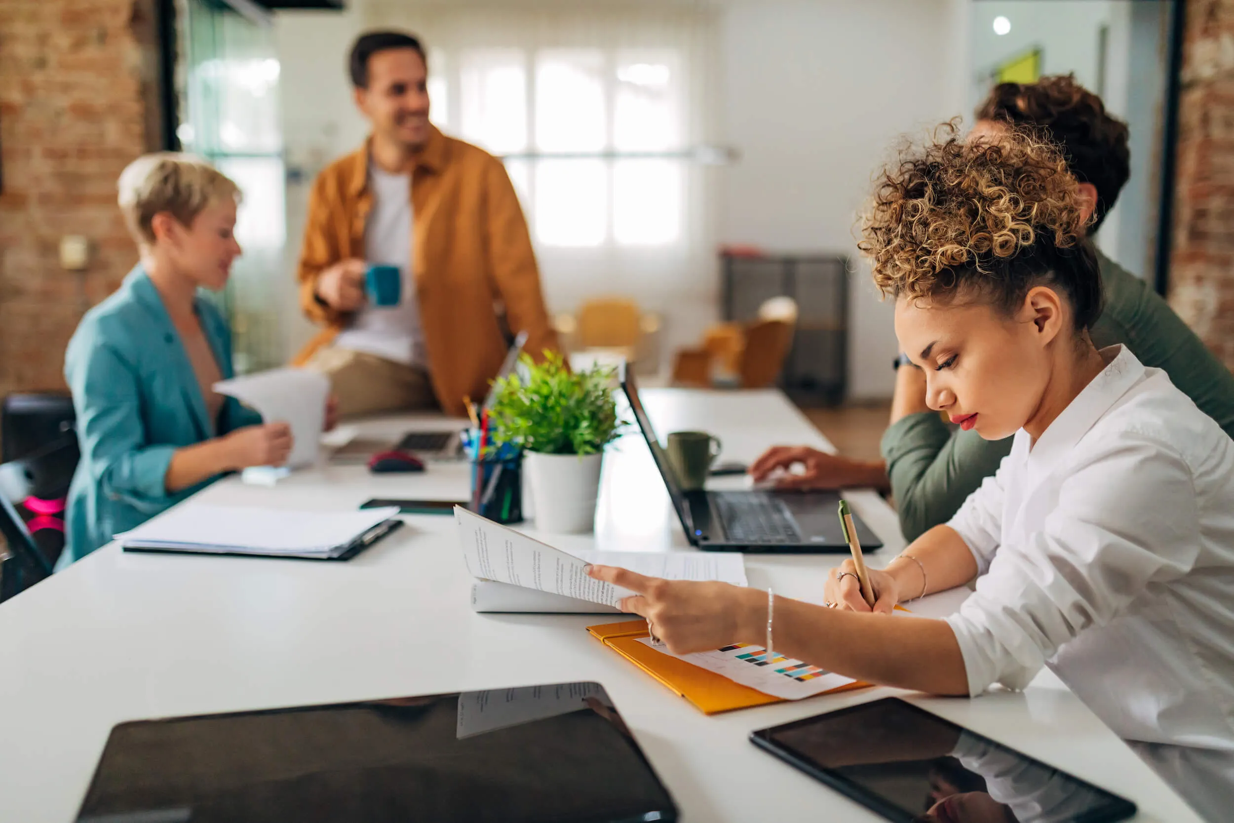 team meeting with one person taking notes