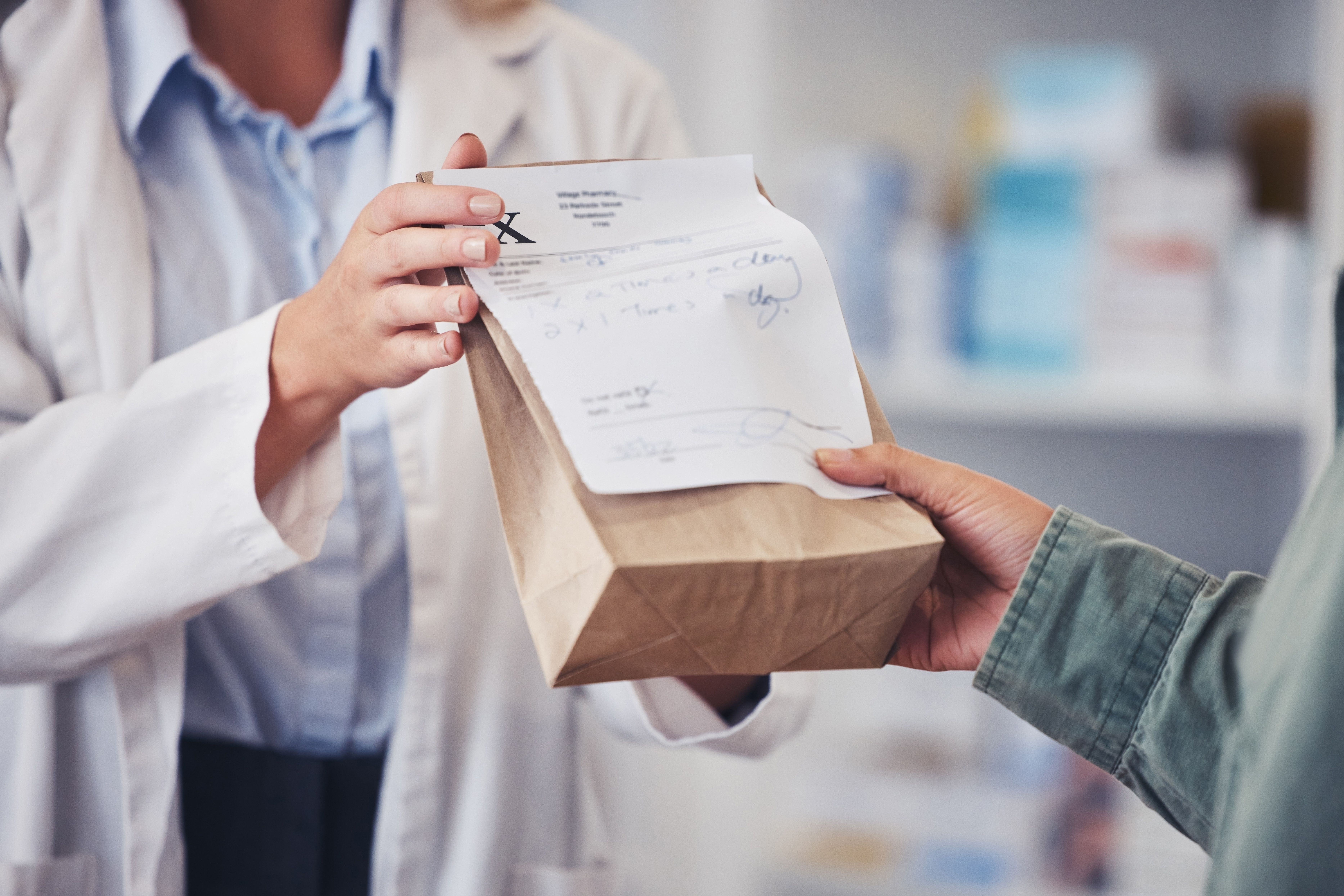 Patient picking up a prescription at the pharmacy -- Image credit: Azee Jacobs/peopleimages.com | stock.adobe.com
