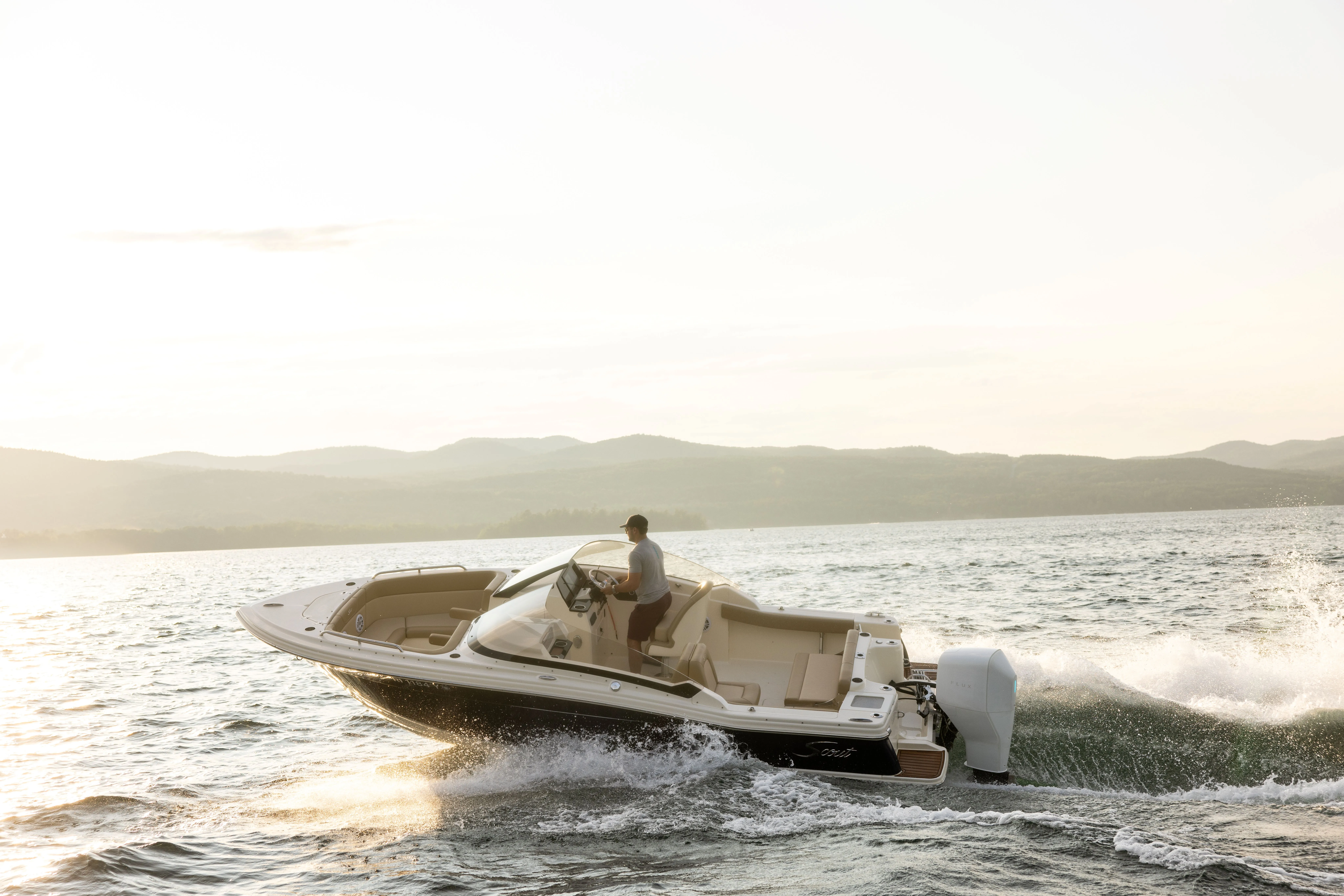 Person enjoying a ride on a Flux boat.